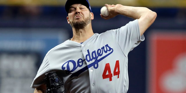 Los Angeles Dodgers' Rich Hill pitches to a Tampa Bay Rays batter during the first inning of a baseball game. (AP Photo/Chris O'Meara)