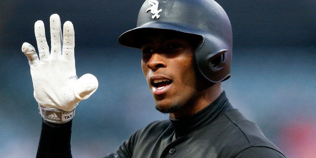 Chicago White Sox's Tim Anderson gestures to the dugout after being walked by Cleveland Indians starting pitcher Jefry Rodriguez during the sixth inning of a baseball game, Tuesday, May 7, 2019, in Cleveland. (AP Photo/Ron Schwane)
