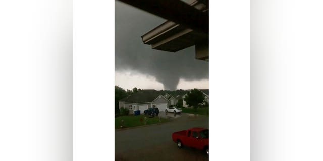 This still image taken from video provided by Chris Higgins shows a tornado, Wednesday, May 22, 2019, in Carl Junction, Mo. The tornado caused some damage in the town of Carl Junction, about 4 miles (6.44 kilometers) north of the Joplin airport. (Chris Higgins via AP)