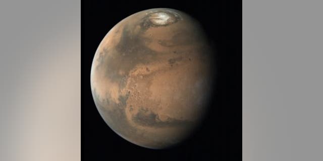 A view of Mars that shows the Red Planet’s northern polar ice cap.