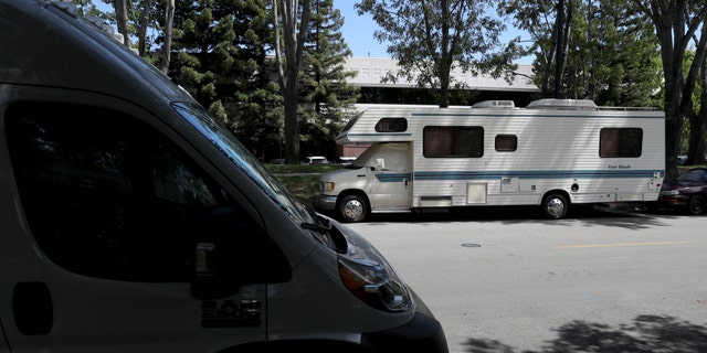 RVs parked on a street across from Google headquarters in Mountain View, California on May 22, 2019.