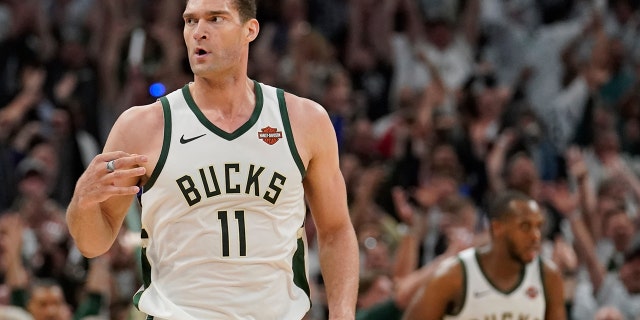 Milwaukee Bucks' Brook Lopez reacts to his three-point basket during the second half of Game 1 of the NBA Eastern Conference basketball playoff finals against the Toronto Raptors Wednesday, May 15, 2019, in Milwaukee. The Bucks won 108-100 to take a 1-0 lead in the series. (AP Photo/Morry Gash)