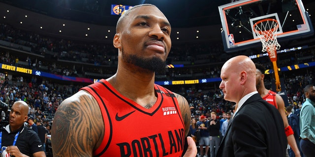 Portland Trail Blazers guard Damian Lillard celebrates after the second half of Game 7 of an NBA basketball second-round playoff series Sunday, May 12, 2019, in Denver. The Trail Blazers won 100-96. (AP Photo/John Leyba)