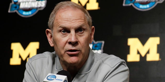 FILE - In this March 27, 2019 file photo Michigan head coach John Beilein speaks during a news conference at the NCAA college basketball tournament in Anaheim, Calif. (AP Photo/Chris Carlson, file)