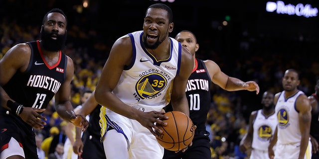 Houston Rockets' James Harden, left, and Golden State Warriors' Kevin Durant (35) react to a referee's call during the second half of Game 5 of a second-round NBA basketball playoff series Wednesday, May 8, 2019, in Oakland, Calif. (AP Photo/Ben Margot)
