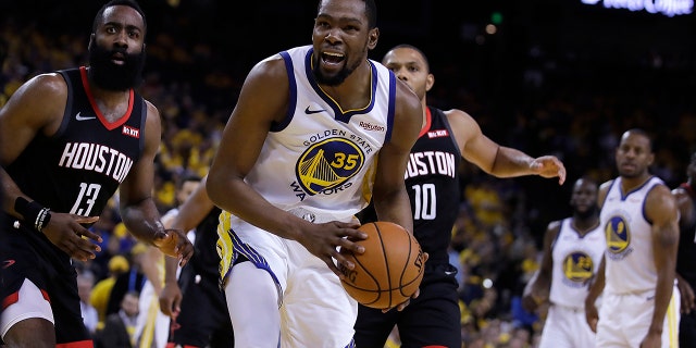 Houston Rockets' James Harden, left, and Golden State Warriors' Kevin Durant (35) react to a referee's call during the second half of Game 5 of a second-round NBA basketball playoff series Wednesday, May 8, 2019, in Oakland, Calif. (AP Photo/Ben Margot)
