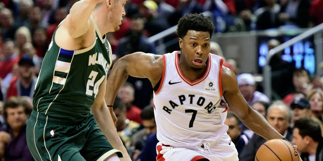 Toronto Raptors guard Kyle Lowry (7) drives for the basket as Milwaukee Bucks guard Pat Connaughton (24) defends during the second half of Game 4 of the NBA basketball playoffs Eastern Conference finals, Tuesday, May 21, 2019 in Toronto. (Frank Gunn/The Canadian Press via AP)