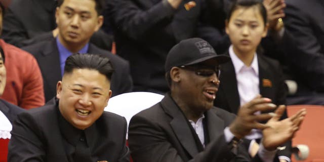 North Korean leader Kim Jong Un and former NBA star Dennis Rodman share a laugh during Rodman's visit to North Korea in 2013.