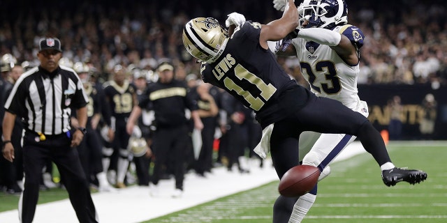 New Orleans Saints wide receiver Tommylee Lewis (11) works for a coach against Los Angeles Rams defensive back Nickell Robey-Coleman (23) during the second half the NFL football NFC championship game Sunday, Jan. 20, 2019, in New Orleans. The Rams won 26-23. (AP Photo/Gerald Herbert)