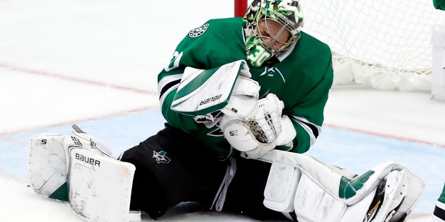 Dallas Stars goaltender Ben Bishop reacts after being hit by a puck during the third period in Game 6 of an NHL second-round hockey playoff series against the St. Louis Blues, Sunday, May 5, 2019, in Dallas. (AP Photo/Tony Gutierrez)