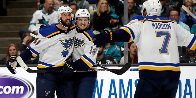 St. Louis Blues' Robert Bortuzzo, left, celebrates with teammates Robert Thomas (18) and Pat Maroon (7) after scoring a goal against the San Jose Sharks in the second period in Game 2 of the NHL hockey Stanley Cup Western Conference finals Monday, May 13, 2019, in San Jose, Calif. (AP Photo/Ben Margot)