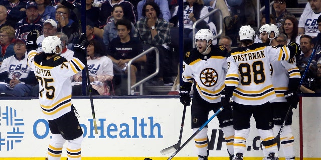 Boston Bruins players celebrate their goal against the Columbus Blue Jackets during the second period of Game 6 of an NHL hockey second-round playoff series Monday, May 6, 2019, in Columbus, Ohio. (AP Photo/Jay LaPrete)