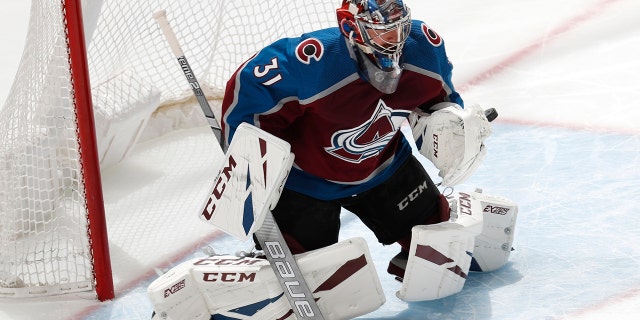 Colorado Avalanche goaltender Philipp Grubauer deflects a San Jose Sharks shot during the first period of Game 4 of an NHL hockey second-round playoff series Thursday, May 2, 2019, in Denver. (AP Photo/David Zalubowski)