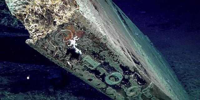 The numbers “2109” are visible on the trailing edge of the shipwreck's rudder.