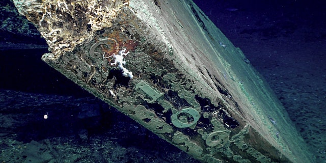 The numbers “2109” are visible on the trailing edge of the shipwreck's rudder.