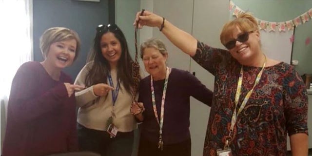 This photo, allegedly taken by the school director, shows four summer school teachers at Palmdale Summerwind smiling, while one of them is holding a noose. 