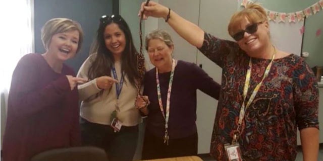 This photo, allegedly taken by the school director, shows four summer school teachers at Palmdale Summerwind smiling, while one of them is holding a noose. 