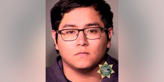 This undated photo provided by the Portland, Ore., Police Bureau on Saturday, May 18, 2019 shows Angel Granados Dias, 18. Police said the Parkrose High School student was tackled after reportedly bringing a gun into a classroom on Friday. (Portland Police Bureau via AP)