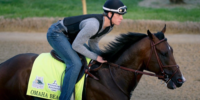 Exerciser Taylor Cambra trains in Omaha Beach at Churchill Downs on Wednesday morning. (AP Photo / Charlie Riedel)