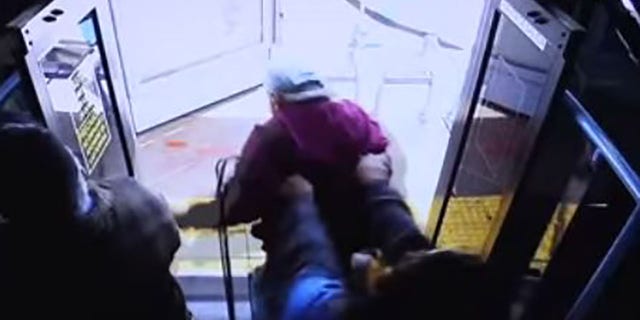 The surveillance video shows Bishop allegedly push Fournier out of the door of the stopped bus.