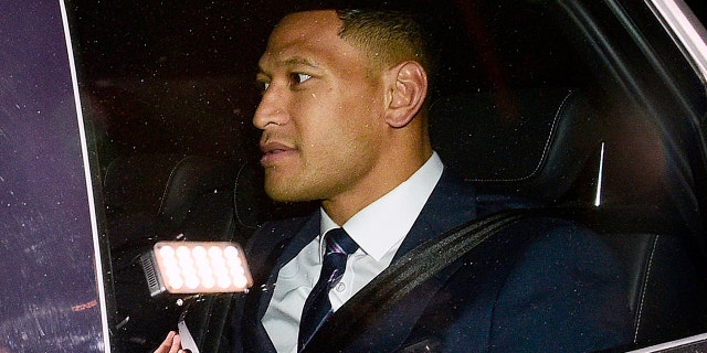Australian rugby union player Israel Folau leaves a Code of Conduct hearing in Sydney, Sunday, May 5, 2019. The 30-year-old Folau appeared before the hearing to fight Rugby Australia's decision to terminate his contract after he posted in mid-April on social media that gay people, along with other "sinners," will face damnation unless they repent. (AAP Image/Bianca De Marchi)