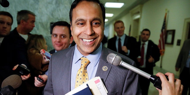 Rep. Raja Krishnamoorthi speaks with reporters.