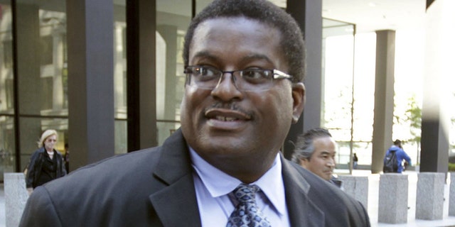 In this Oct. 9, 2013 photo, former Chicago Police Sgt. Ronald Watts, right, leaves the Dirksen U.S. Courthouse after being sentenced to 22 months in prison. Chicago has paid out more than $650 million in police misconduct cases over the past 15 years or so, and that expenditure is expected to increase yet more. (Phil Velasquez/Chicago Tribune via AP)