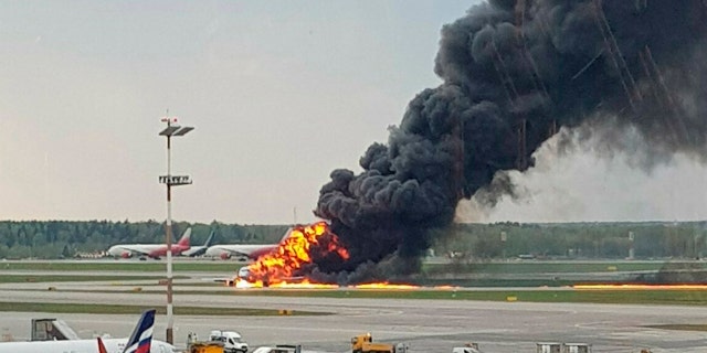 In this image provided by Riccardo Dalla Francesca shows smoke rises from a fire on a plane at Moscow's Sheremetyevo airport on Sunday, May 5, 2019.