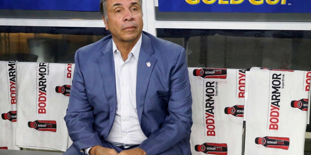 FILE - In this July 22, 2017, file photo, United States head coach Bruce Arena sits on the bench prior to a CONCACAF Gold Cup semifinal soccer match against Costa Rica, in Arlington, Texas. The New England Revolution have hired five-time MLS Cup winner and former U.S. national coach Bruce Arena as its coach and sports director. (AP Photo/LM Otero, File)