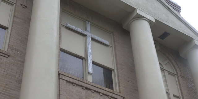 The crosses are displayed on the sides of the San Jacinto County Courthouse. They are lit up during the holiday season.