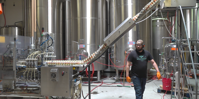 Canning process at Huss Brewing's Tempe location