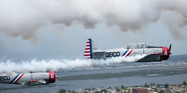 The Geico Skytypers fly a restored SNJ-2 plane -- also called a T-6 Texan by the Army Air Corps -- that originally was produced to train Allied pilots during World War II. Each plane is equipped with a system that can release streams of smoke to 'type' messages in the sky.