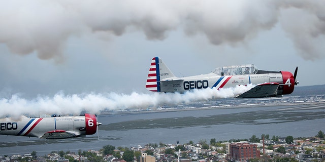 The Geico Skytypers fly a restored SNJ-2 plane -- also called a T-6 Texan by the Army Air Corps -- that originally was produced to train Allied pilots during World War II. Each plane is equipped with a system that can release streams of smoke to 'type' messages in the sky.