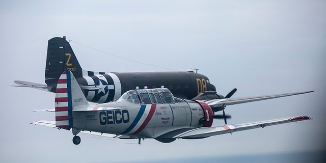During a symbolic flight hosted by the American Airpower Museum on Long Island, the Skytypers flew by the Statue of Liberty alongside a Douglas C-47 -- a military transport aircraft used to deploy paratroopers during D-Day.