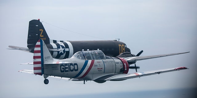 During a symbolic flight hosted by the American Airpower Museum on Long Island, the Skytypers flew by the Statue of Liberty alongside a Douglas C-47 -- a military transport aircraft used to deploy paratroopers during D-Day.