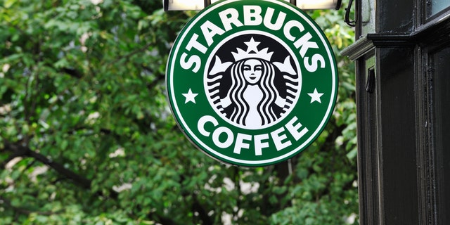 Edinburgh, Scotland - July 19, 2011:  A Starbucks Coffee sign outside a Starbucks Coffee outlet on Edinburgh's Royal Mile.