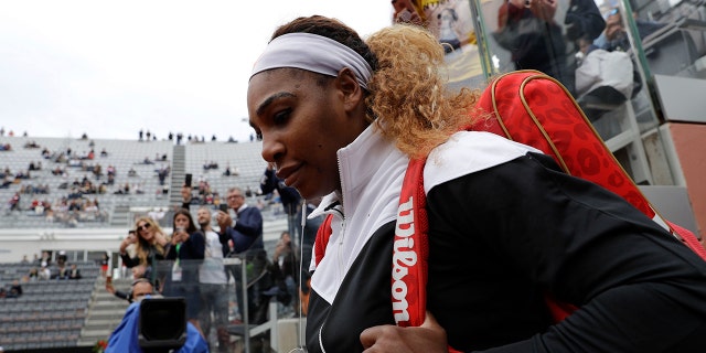 Serena Williams, of the United States, enters the central court to start her match against Sweden's Rebecca Peterson at the Italian Open tennis tournament, in Rome, Monday, May, 13, 2019. (AP Photo/Gregorio Borgia)