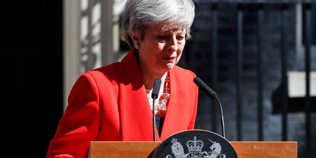 British Prime Minister Theresa May reacts as she turns away after making a speech in the street outside 10 Downing Street in London, England, Friday, May 24, 2019. Theresa May says she'll quit as UK Conservative leader on June 7, sparking contest for Britain's next prime minister. 