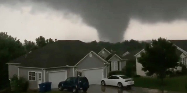 This still image taken from video provided by Chris Higgins shows a tornado, Wednesday, May 22, 2019, in Carl Junction, Mo. The tornado caused some damage in the town of Carl Junction, about 4 miles north of the Joplin airport.