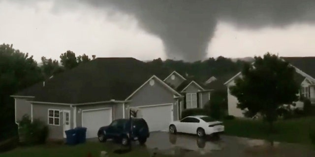 This still image taken from video provided by Chris Higgins shows a tornado in Carl Junction, Mo., on Wednesday, May 22, 2019. The tornado caused damage in the town about 4 miles north of the Joplin airport. (Chris Higgins via AP)