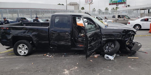 A damaged truck is seen after Mexican police said an American man tried to rush the U.S. border in Tijuana and crashed into 17 vehicles, vendor carts, and ran over 5 people on Monday.