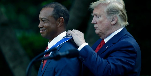 President Donald Trump awards golfer Tiger Woods the Presidential Medal of Freedom, in the Rose Garden of the White House, Monday, May 6, 2019, in Washington. (AP Photo/Evan Vucci)