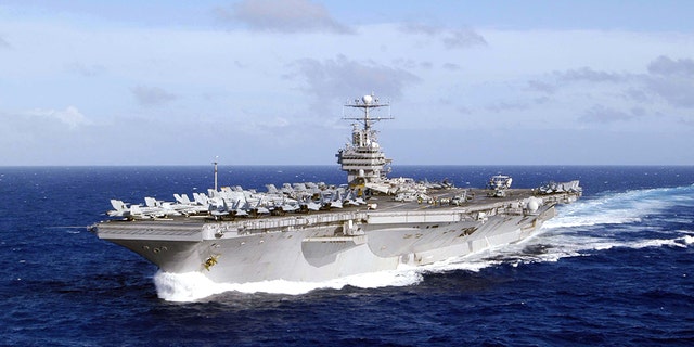 The USS Abraham Lincoln in the waters of Western Pacific Ocean in 2004. The ship is now heading to the Middle East.