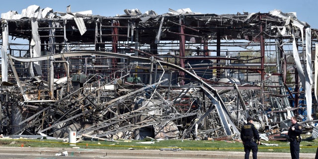 Emergency personnel work at the scene of an explosion at AB Specialty Silicones on Sunset and Northwestern Avenues on the border between Gurnee, Ill., and Waukegan on Saturday. The explosion happened Friday night. (John Starks/Daily Herald via AP)