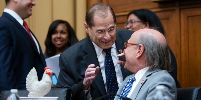 House Judiciary Committee Chair Jerrold Nadler, D-N.Y., is greeted by Rep. Steve Cohen, D-Tenn., as they wait to start a hearing on the Mueller report without witness Attorney General William Barr who refused to appear. Rep. Cohen brought props for symbolism, and a bucket of fried chicken. (AP Photo/J. Scott Applewhite)