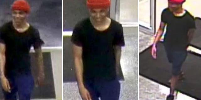 The suspect, later identified as Atkinson, appears to be between 5-foot-7 and 5-foot-10.