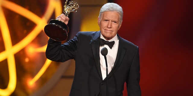 Alex Trebek accepts the award for outstanding game show host for "Jeopardy!" at the 46th annual Daytime Emmy Awards at the Pasadena Civic Center on Sunday, May 5, 2019, in Pasadena, Calif. (Photo by Chris Pizzello/Invision/AP)