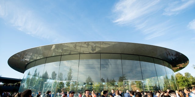 Attendees gather for a product launch event at Apple's Steve Jobs Theater on Sept. 12, 2018, in Cupertino, California. (Photo by NOAH BERGER/AFP)