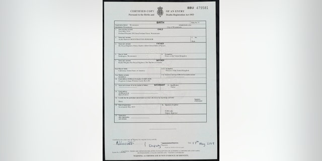 A copy of the birth certificate of Archie Harrison Mountbatten-Windsor, son of Britain's Prince Harry and Meghan, the Duchess of Sussex, in London, Friday May 17, 2019. The birth certificate reveals that Archie was born in a private hospital in London. (Jonathan Brady/PA via AP)