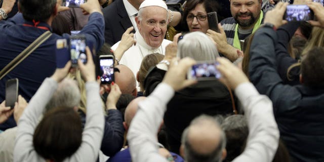 Pope Francis arrives for an audience with participants of a pilgrimage of the Italian-Albanian diocese of Lungro, in the Pope Paul VI hall, at the Vatican, Saturday, May 25, 2019.
